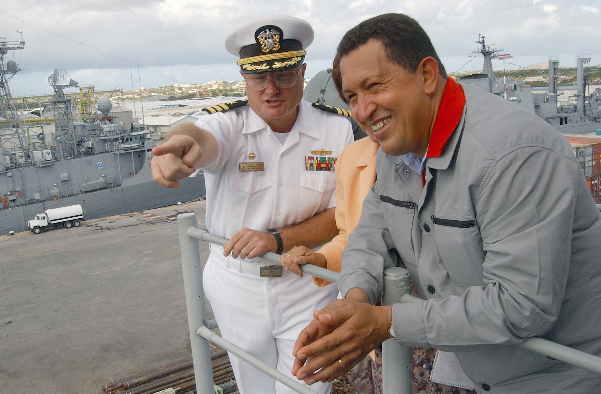 US Navy (USN) Commander (CDR) Robert S. Kerno (left), Commanding Officer (CO), USN Ticonderoga Class Cruiser USS YORKTOWN (CG 48), points out some sights to the President of Venezuela, Hugo Chavez during a tour of the ship. The YORKTOWN is visiting the city of Willemstad at Curacao, Netherlands Antilles north of Venezuela during the 43rd annual UNITAS (Unity in Spanish) exercise. UNITAS is the largest multi-national naval exercise conducted by US, Caribbean, Central, and South American naval forces with the focus on building a hemispheric coalition for mutual defense and cooperation.